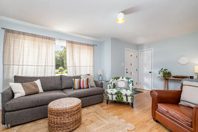 a living room with furniture and window