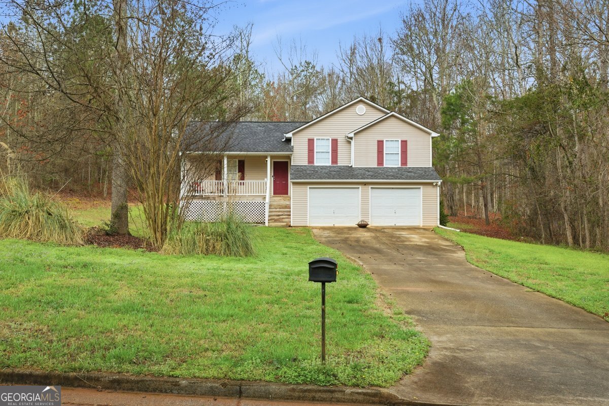170 Hunters Trace Covington, GA 30014 - Photo 1 of 29 a front view of a house with garden