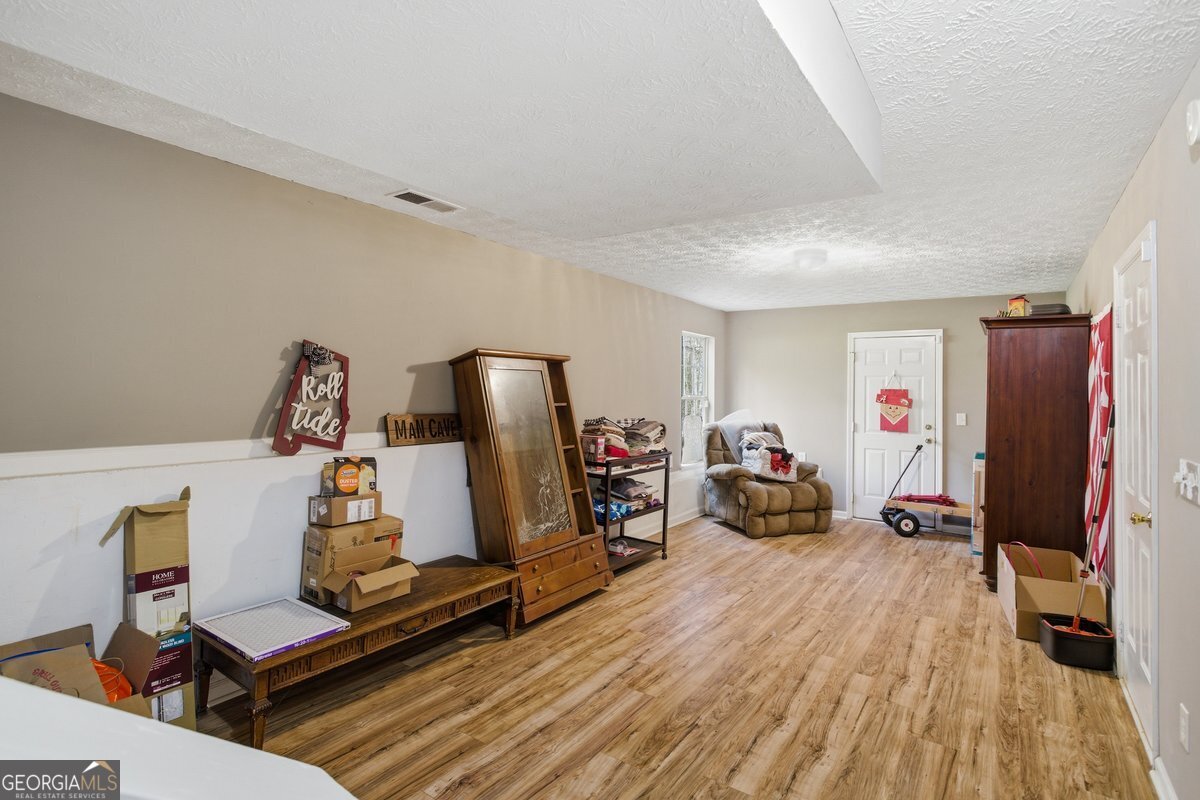 170 Hunters Trace Covington, GA 30014 - Photo 25 of 29 a view of a room with gym equipment