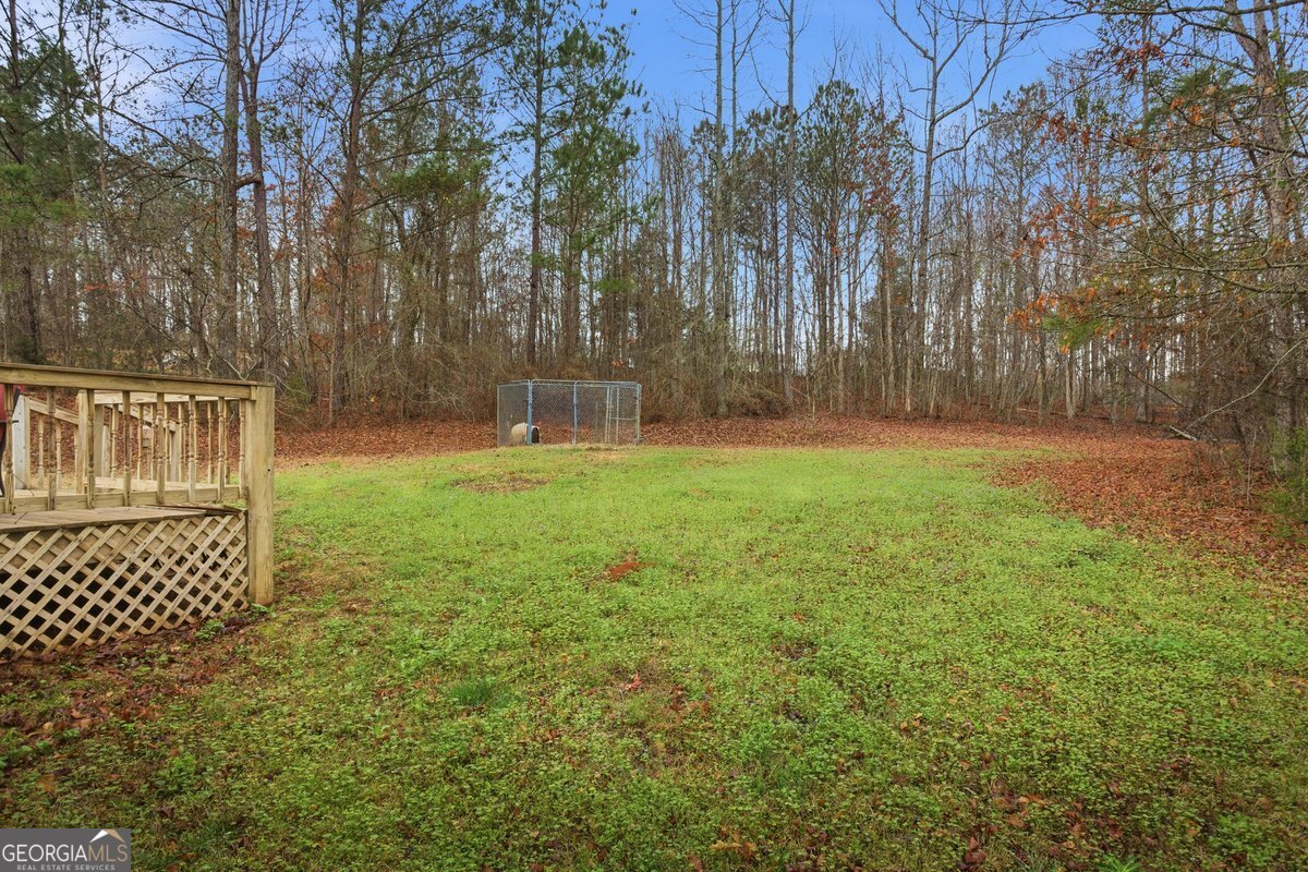 170 Hunters Trace Covington, GA 30014 - Photo 8 of 29 a backyard of a house with lots of green space and fountain