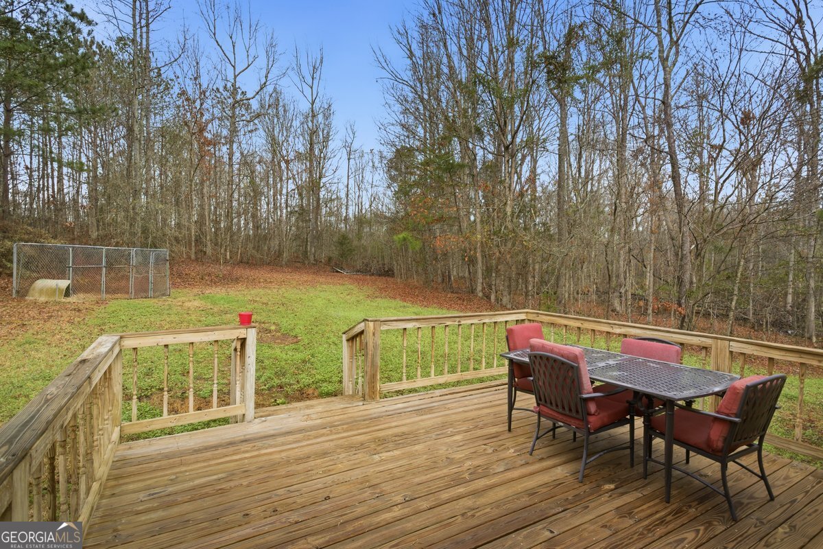 170 Hunters Trace Covington, GA 30014 - Photo 10 of 29 a view of a chairs and table on the wooden floor
