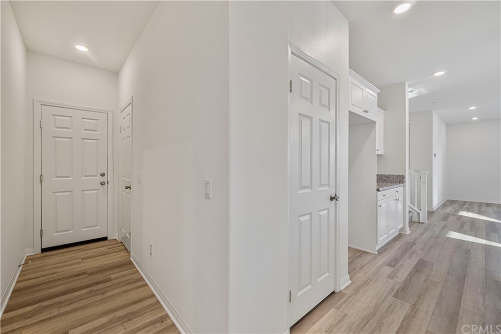 1752 Apricot Tree Place Upland, CA 91784 - Photo 11 of 23 a view of a hallway with wooden floor