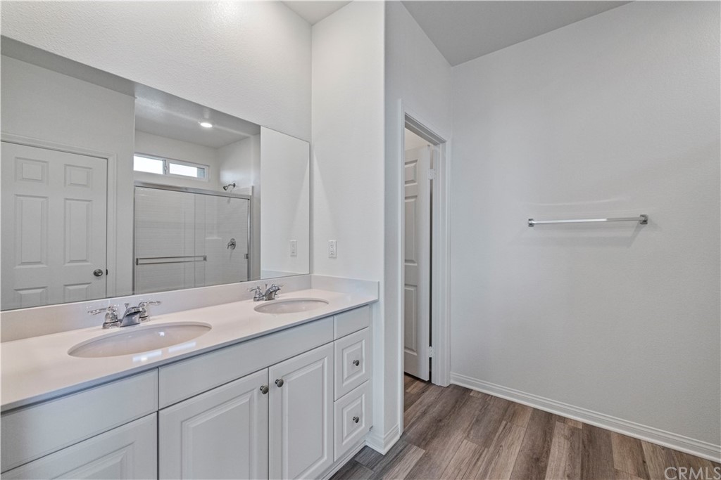 1752 Apricot Tree Place Upland, CA 91784 - Photo 18 of 23 a bathroom with a granite countertop sink a mirror and a