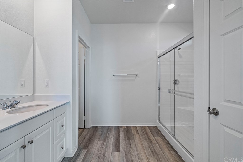 1752 Apricot Tree Place Upland, CA 91784 - Photo 19 of 23 a bathroom with a sink a mirror and a shower