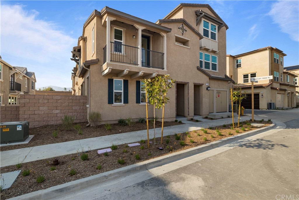 1752 Apricot Tree Place Upland, CA 91784 - Photo 2 of 23 a front view of a house with street