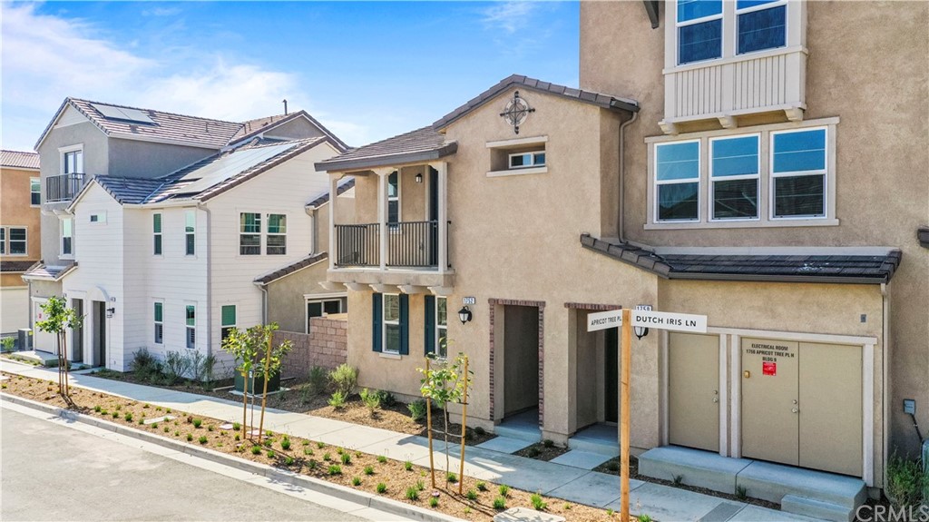 1752 Apricot Tree Place Upland, CA 91784 - Photo 22 of 23 a front view of a building with a street