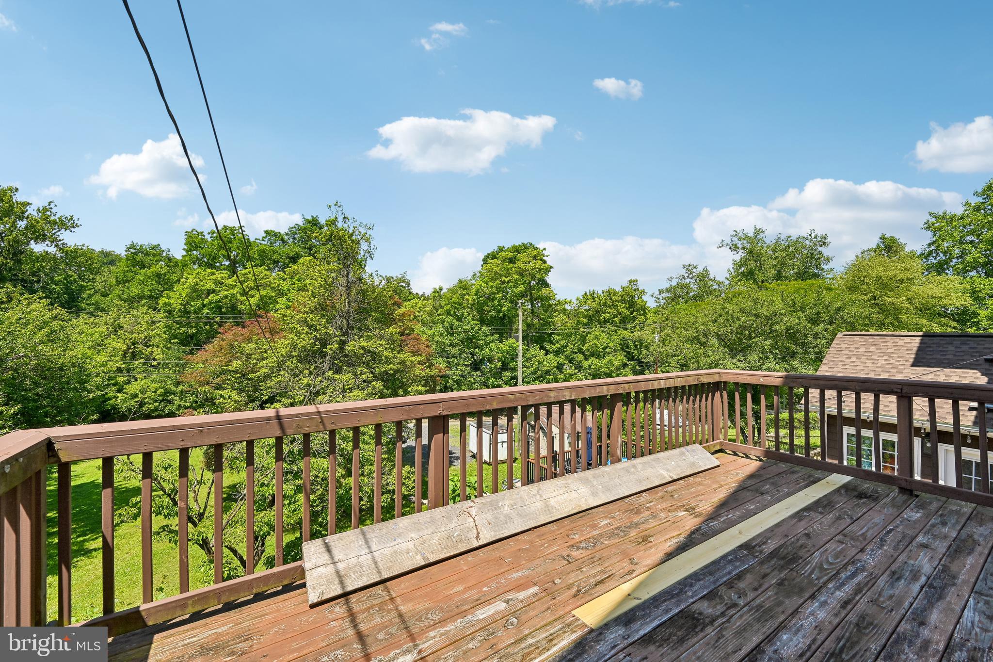 5702 Falls Road Baltimore, MD 21209 - Photo 34 of 49 a view of balcony with wooden floor