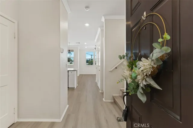 a view of a hallway with wooden floor