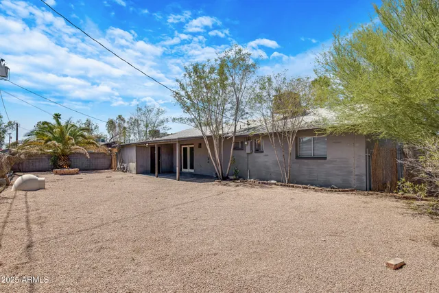 a house with trees in front of it