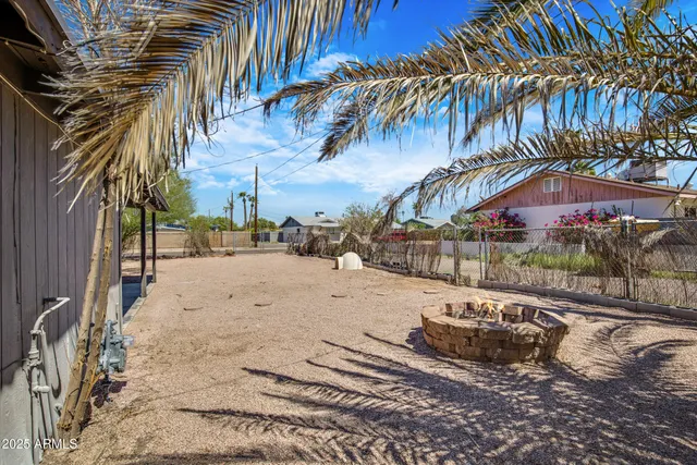 a view of a yard with car parked