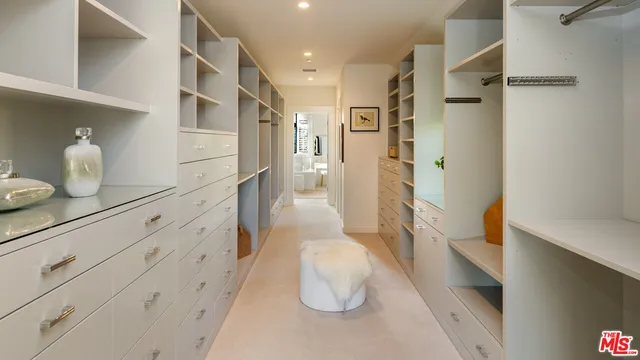 a bathroom with a sink and glass door