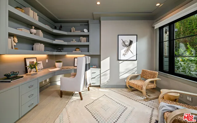 a bedroom with furniture and a window