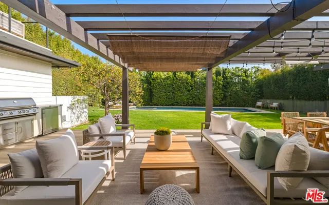 a view of swimming pool with a patio
