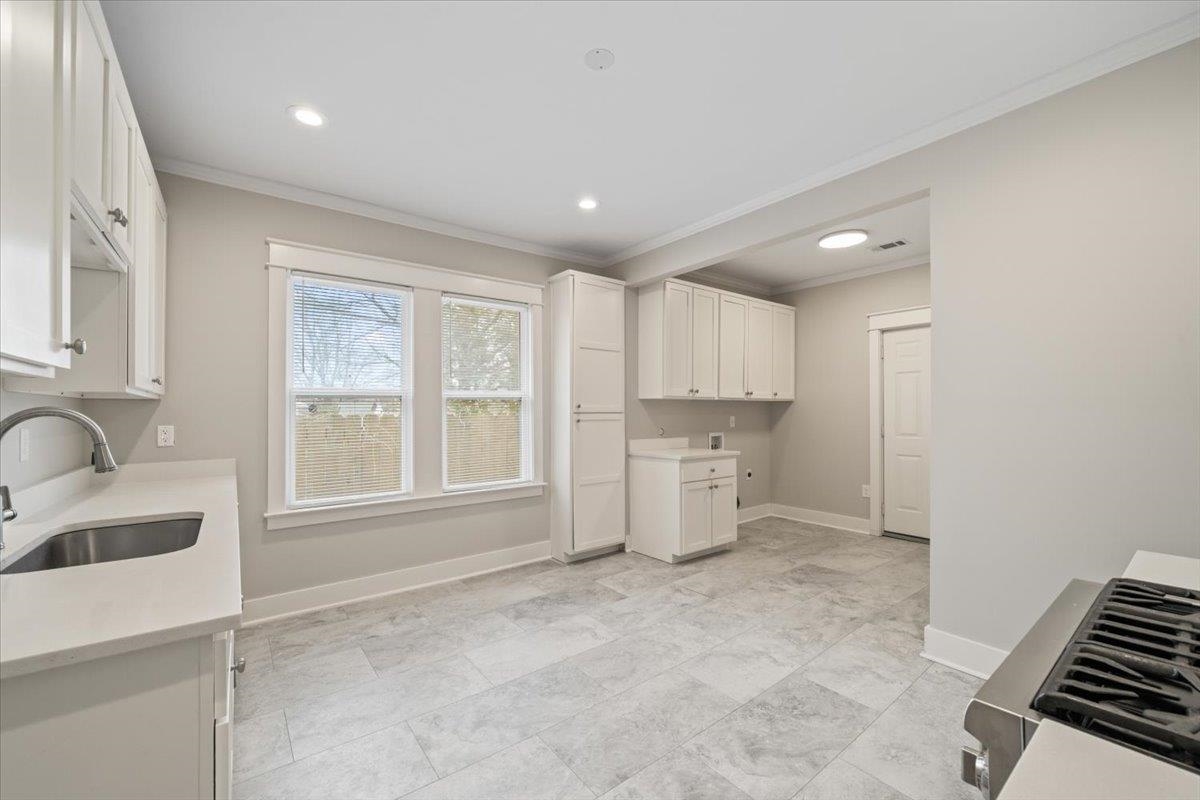 598 Spring Street Memphis, TN 38112 - Photo 11 of 29 a view of a kitchen with a sink and dishwasher kitchen view