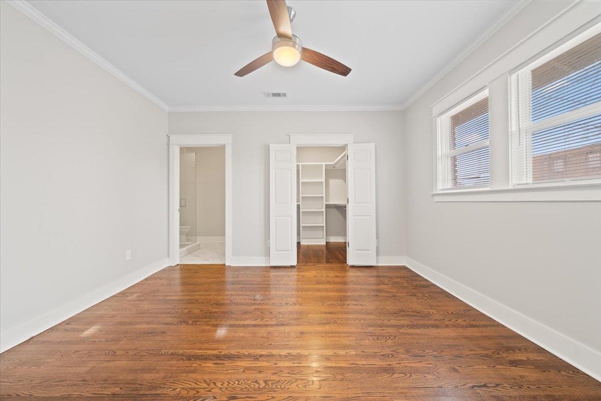 598 Spring Street Memphis, TN 38112 - Photo 17 of 29 a view of an empty room with window and wooden floor
