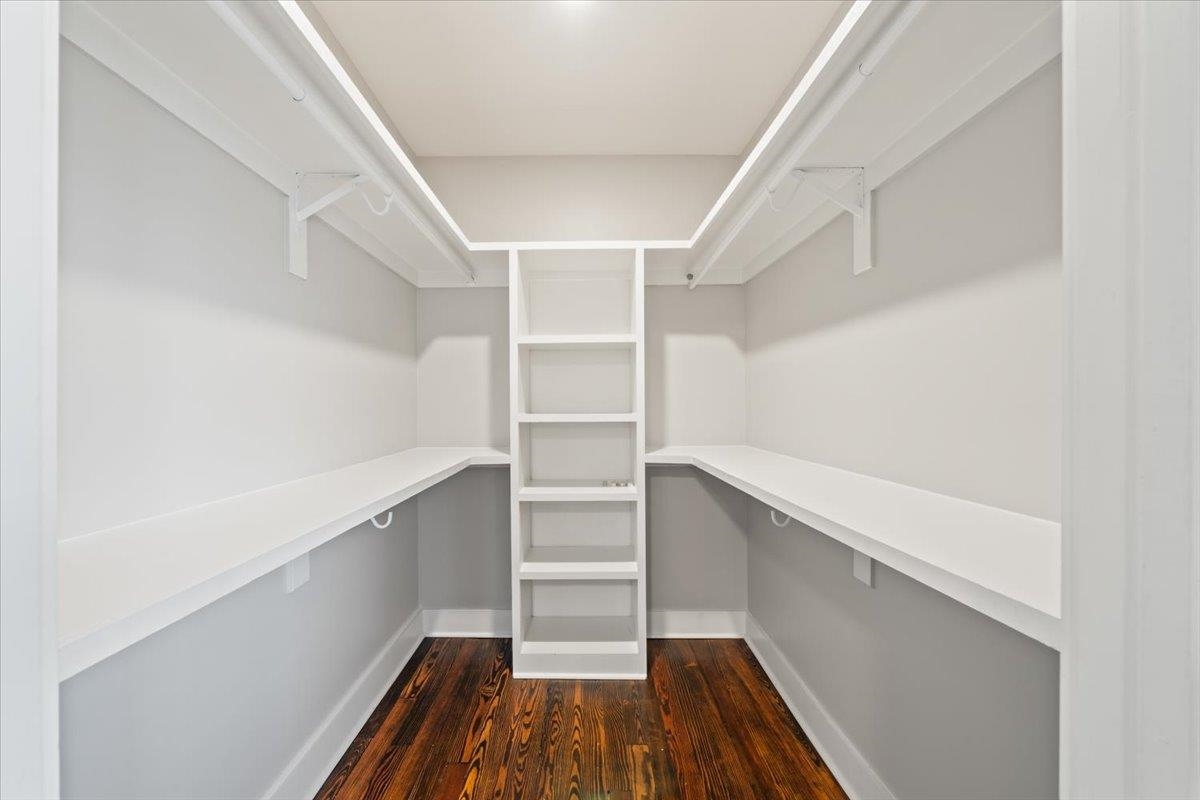 598 Spring Street Memphis, TN 38112 - Photo 18 of 29 a view of walk in closet with empty racks