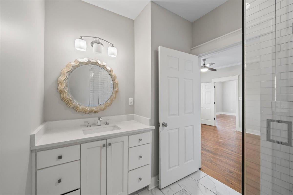 598 Spring Street Memphis, TN 38112 - Photo 19 of 29 a bathroom with a double vanity sink mirror and shower