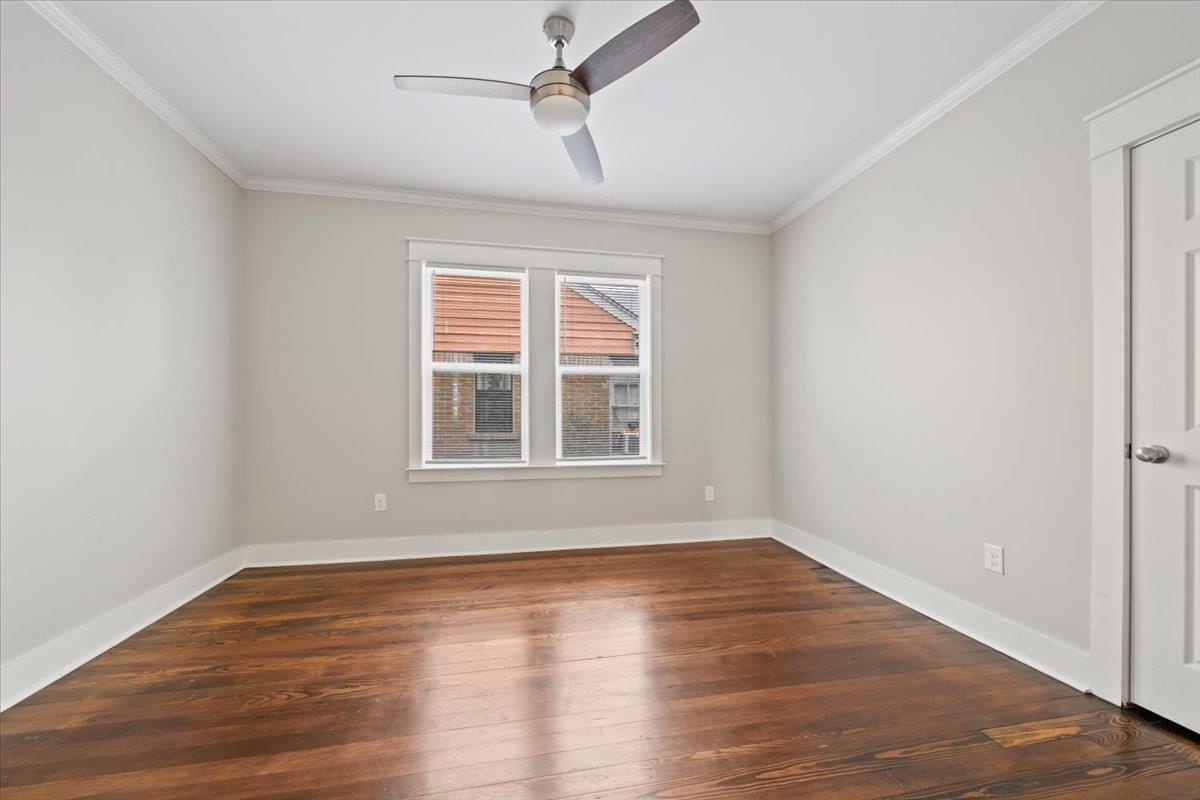 598 Spring Street Memphis, TN 38112 - Photo 20 of 29 a view of empty room with wooden floor and fan
