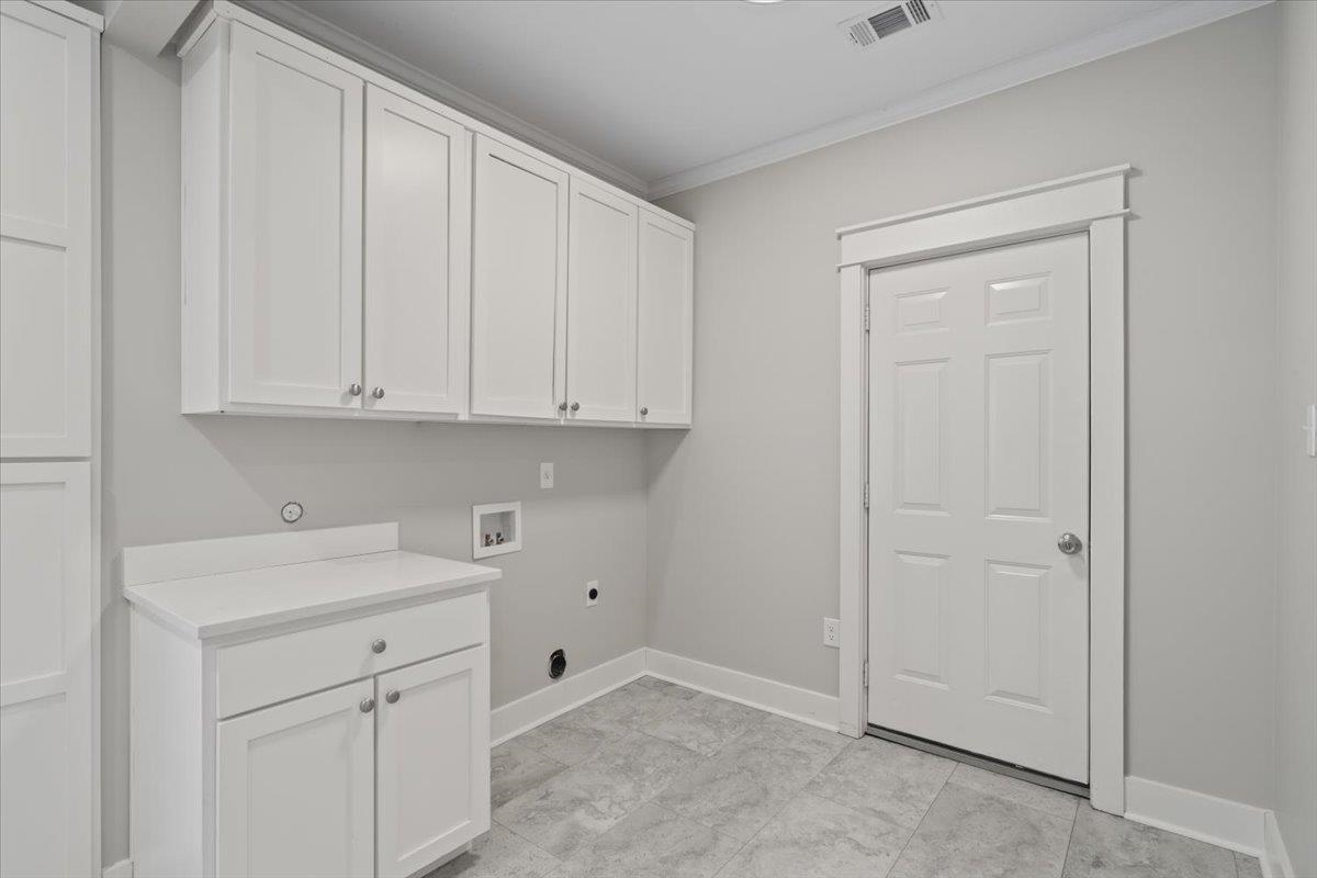 598 Spring Street Memphis, TN 38112 - Photo 22 of 29 a view of a kitchen with white cabinets