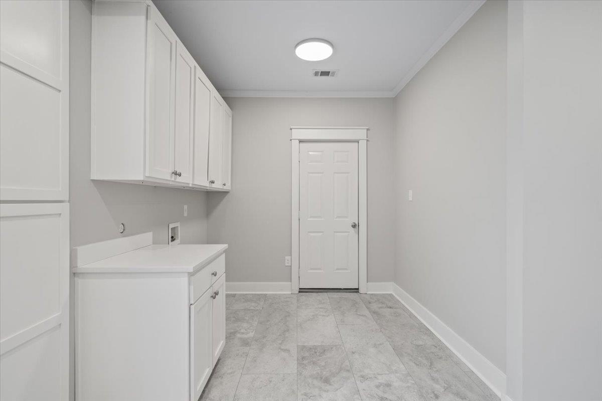 598 Spring Street Memphis, TN 38112 - Photo 23 of 29 a view of a storage and utility room with a sink