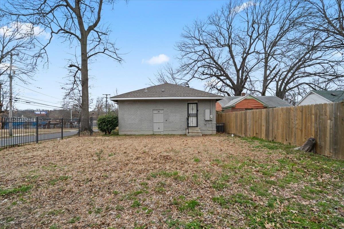 598 Spring Street Memphis, TN 38112 - Photo 24 of 29 a house with trees in front of it