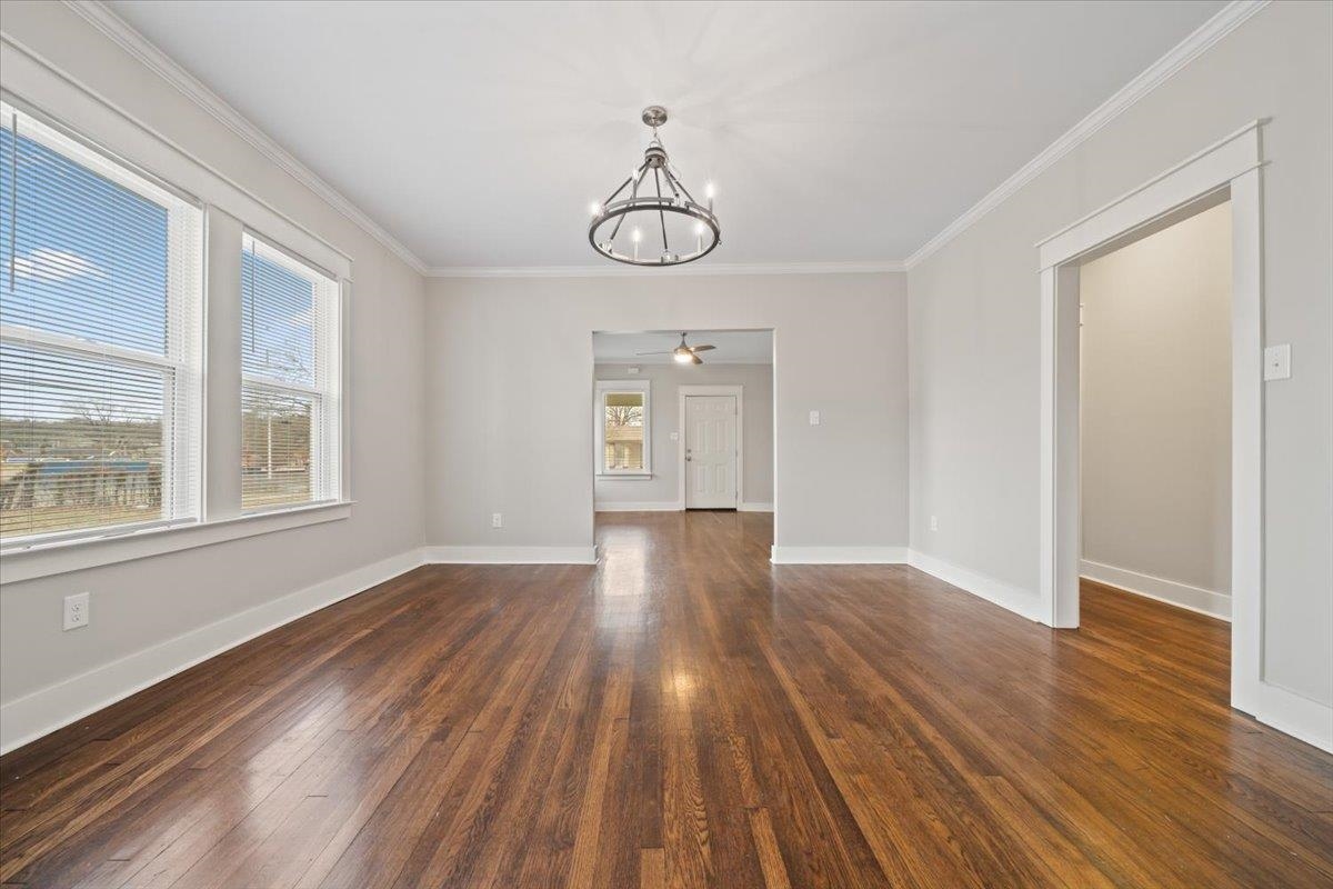 598 Spring Street Memphis, TN 38112 - Photo 6 of 29 a view of empty room with wooden floor and fan