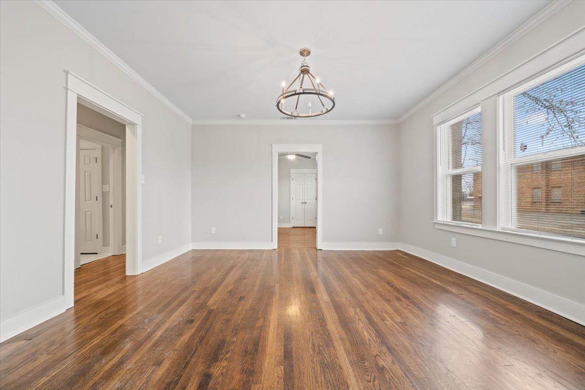 598 Spring Street Memphis, TN 38112 - Photo 8 of 29 a view of empty room with wooden floor and fan