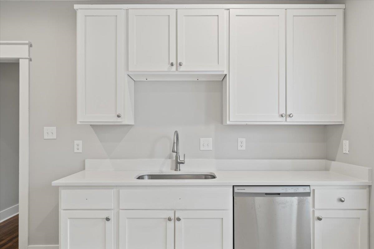 598 Spring Street Memphis, TN 38112 - Photo 10 of 29 a kitchen with white cabinets and a sink
