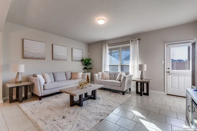 a living room with furniture and a window