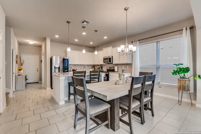 a view of a dining room with furniture
