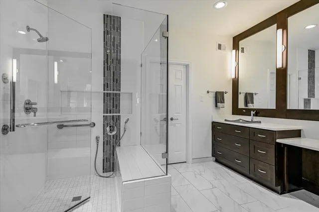 a bathroom with a tub sink and mirror