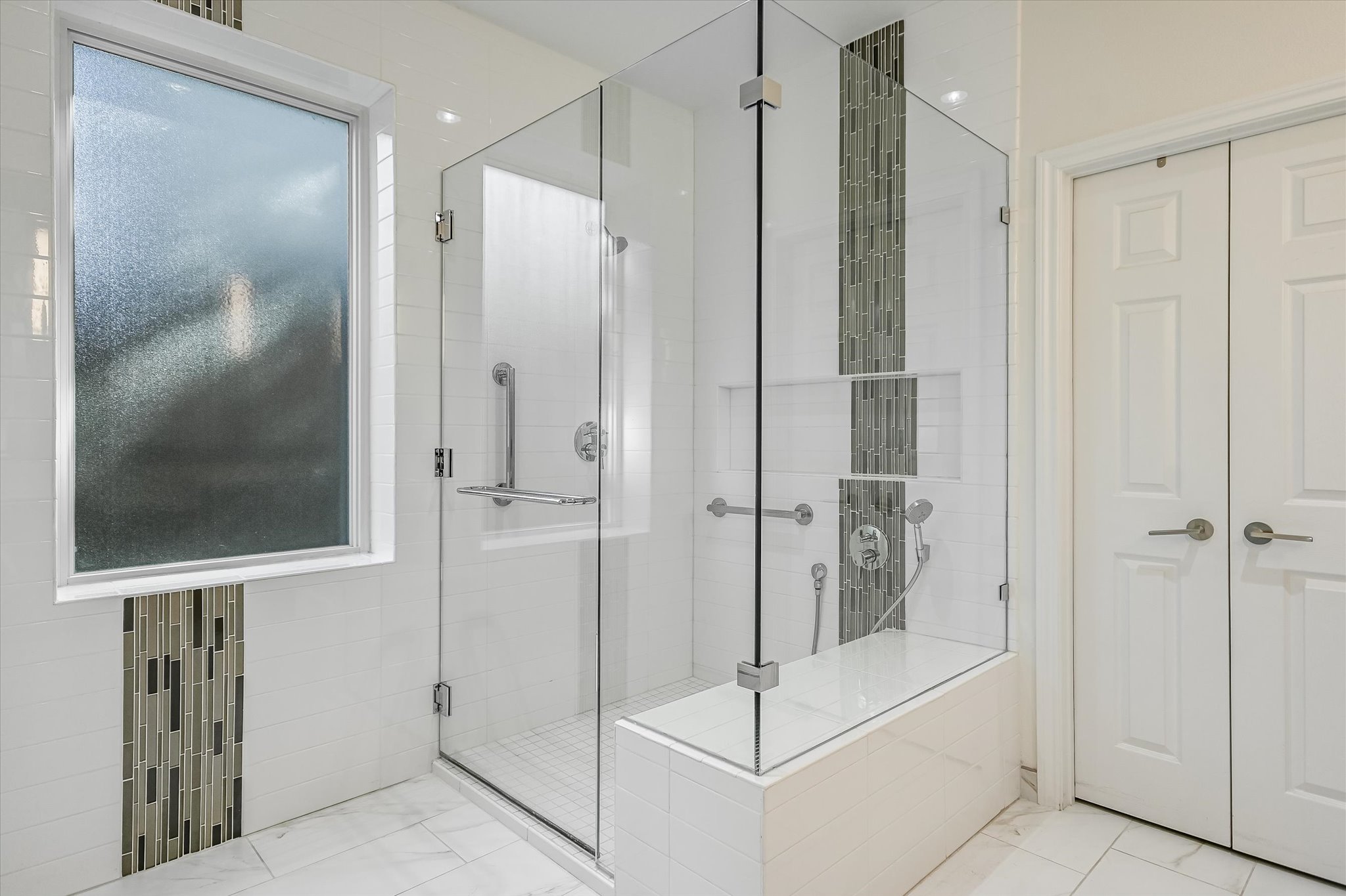 7901 Jester Boulevard Austin, TX 78730 - Photo 18 of 40 a bathroom with a shower and a glass door