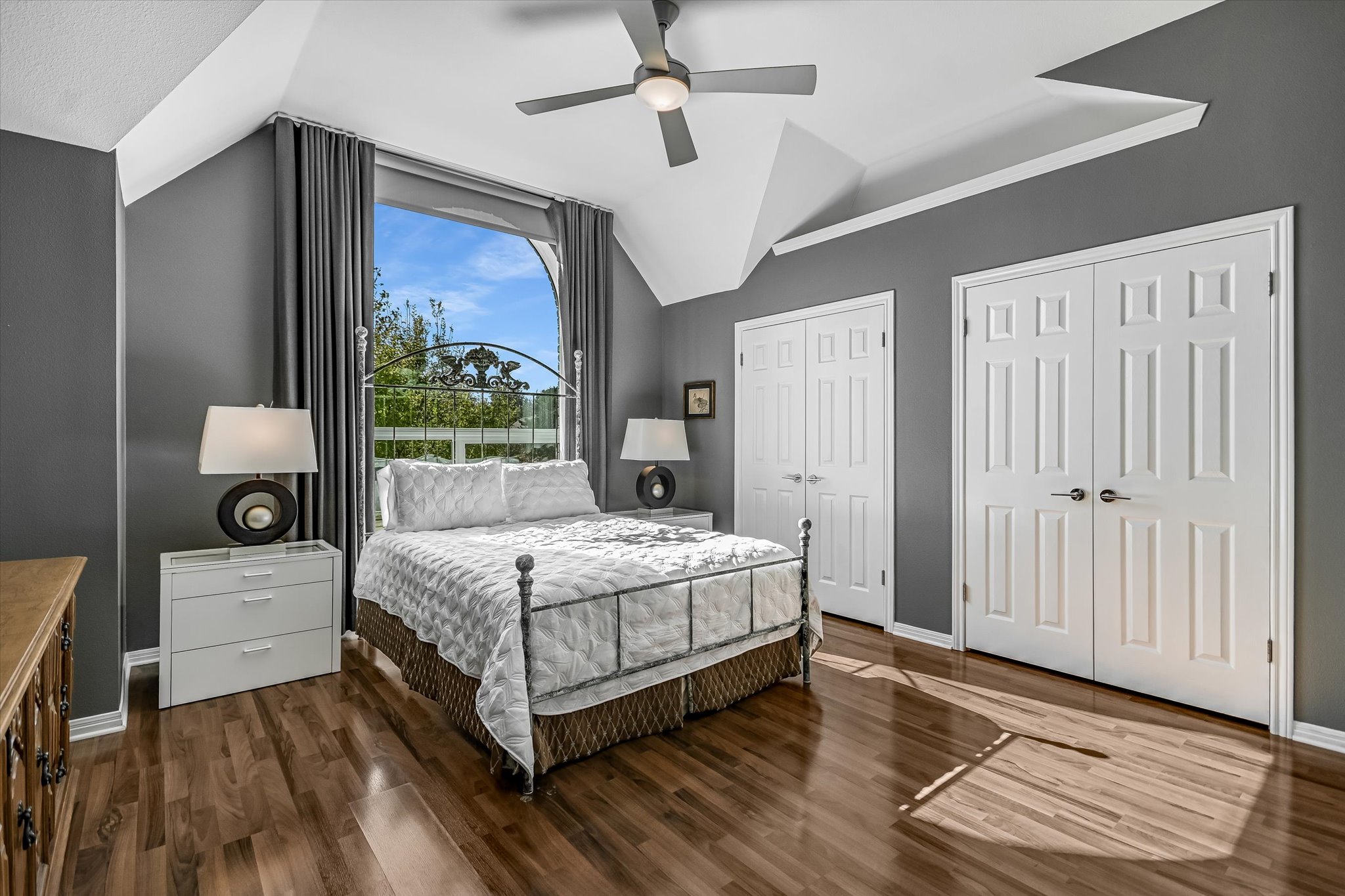 7901 Jester Boulevard Austin, TX 78730 - Photo 19 of 40 a bedroom with a large bed and a window