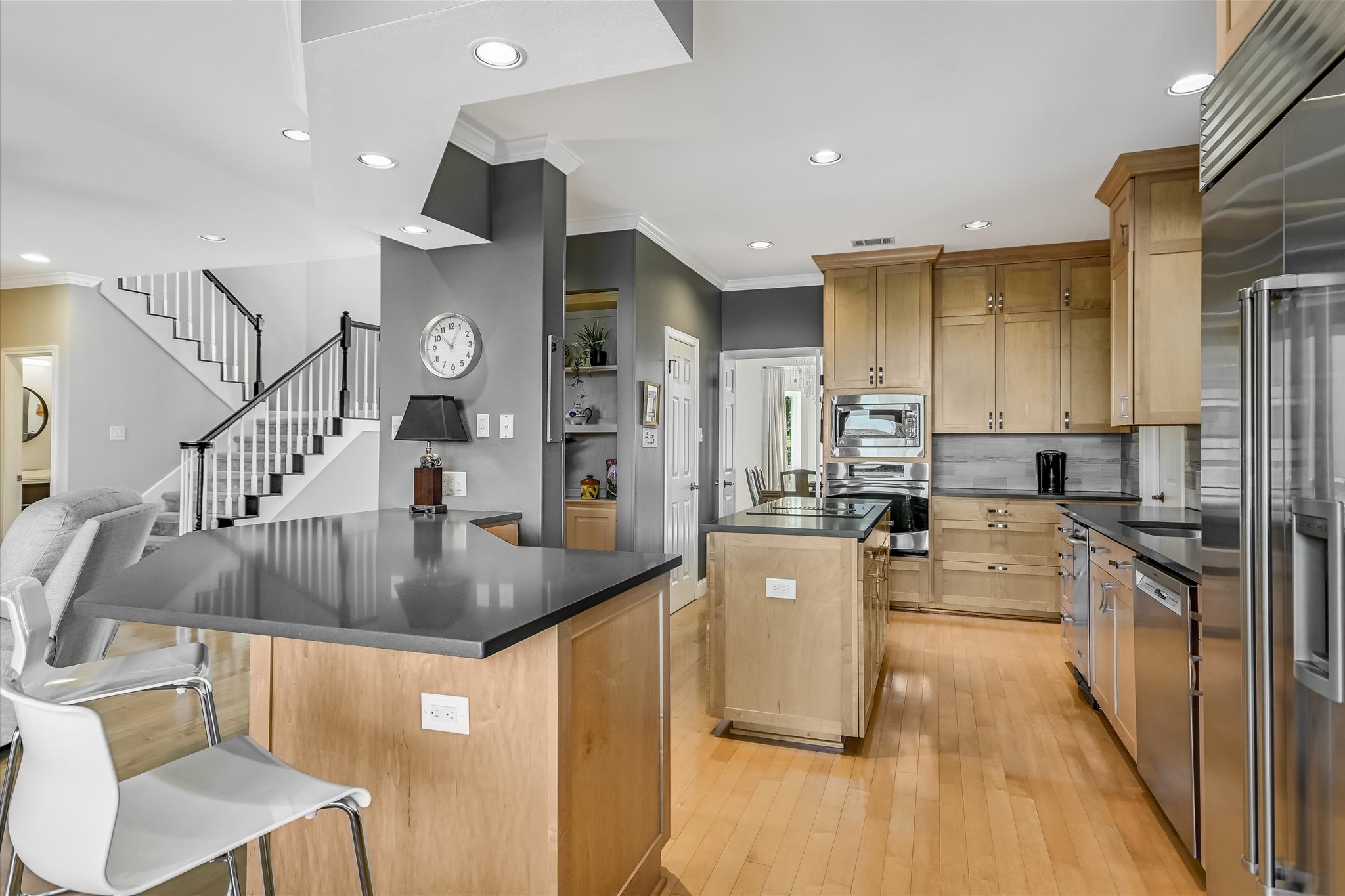 7901 Jester Boulevard Austin, TX 78730 - Photo 5 of 40 a kitchen with stainless steel appliances granite countertop a sink a stove and a refrigerator