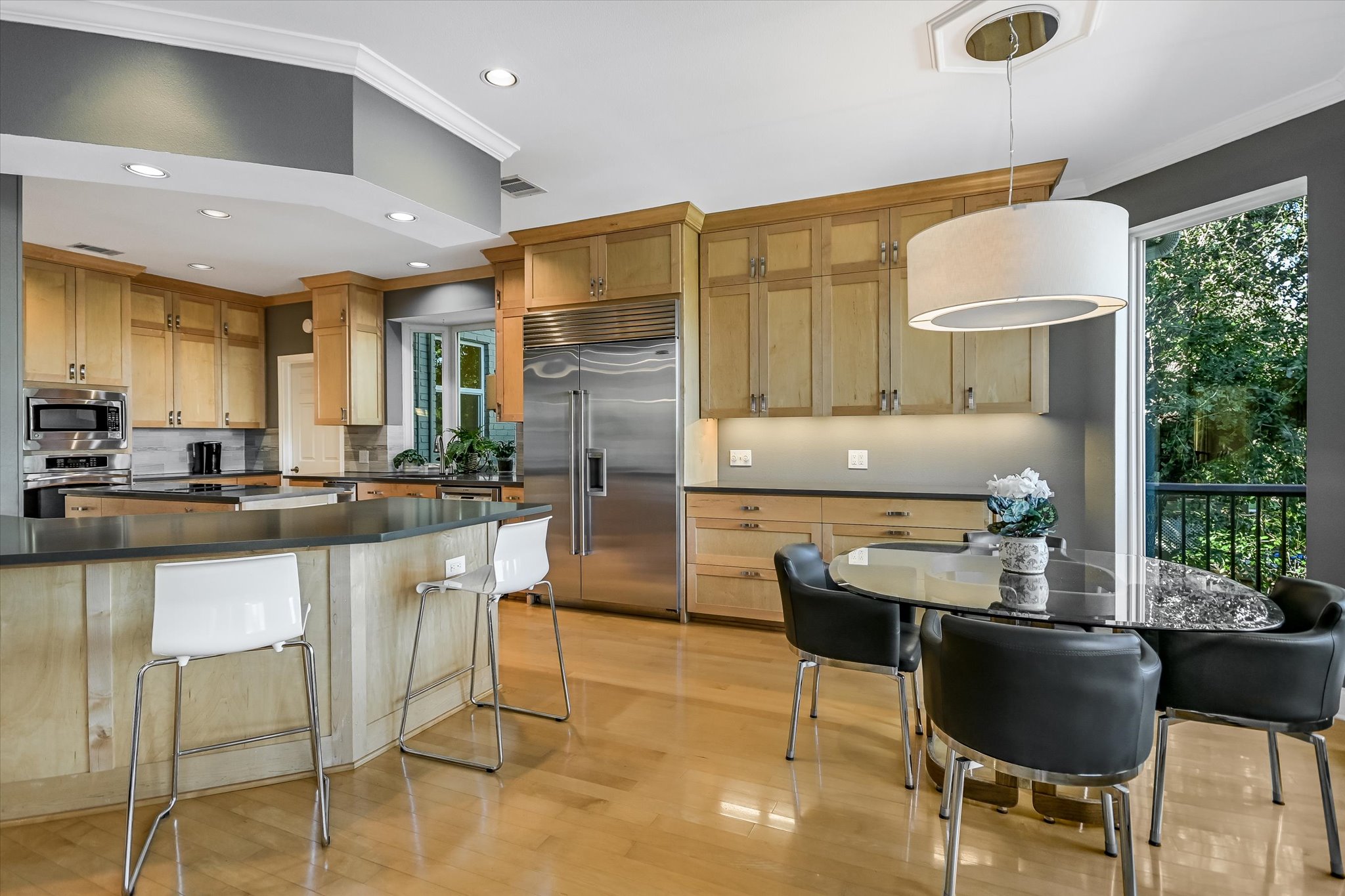 7901 Jester Boulevard Austin, TX 78730 - Photo 6 of 40 a kitchen with granite countertop a table chairs stove and granite counter top