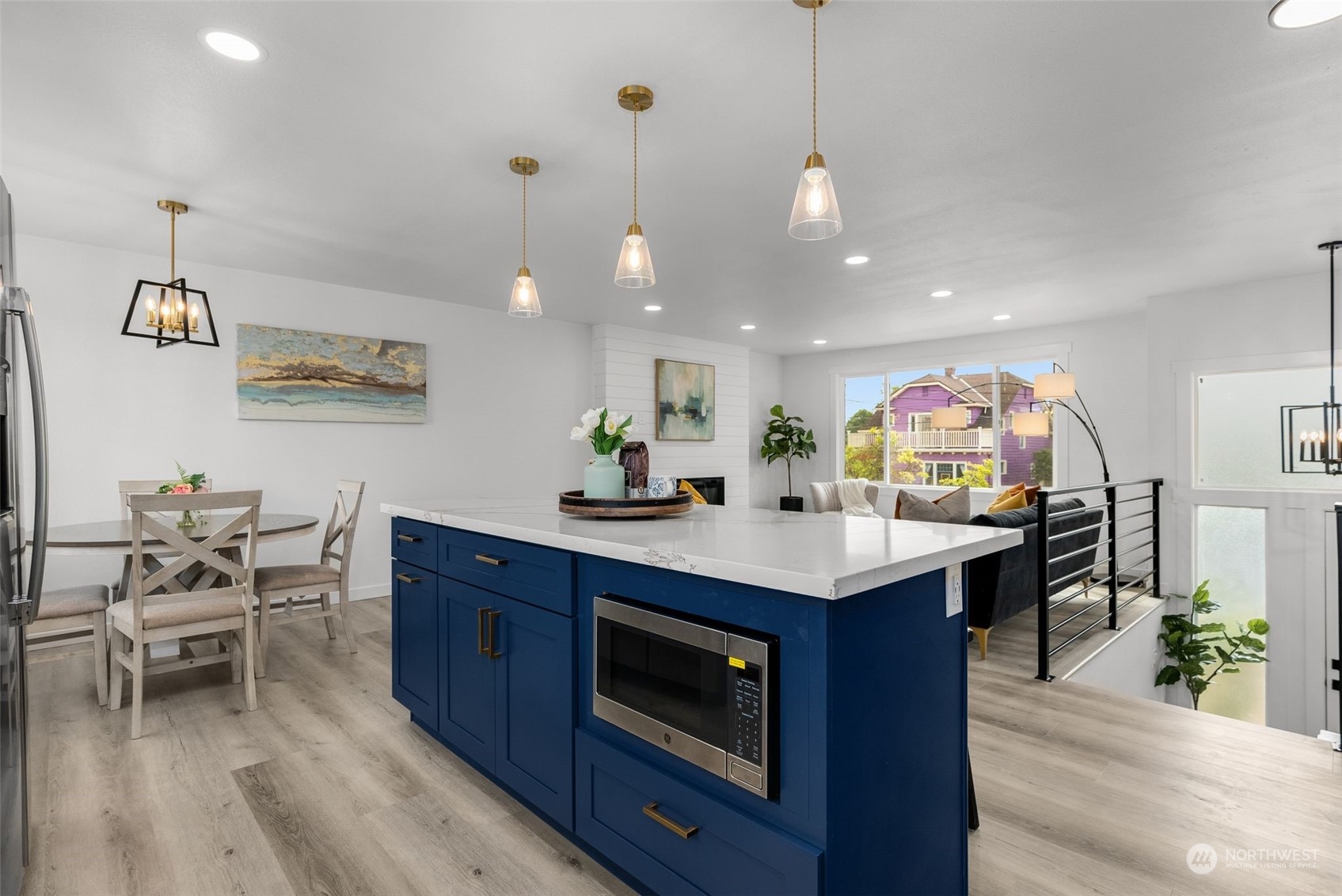 3932 South Morgan Street Seattle, WA 98118 - Photo 12 of 40 a kitchen with a dining table cabinets and wooden floor