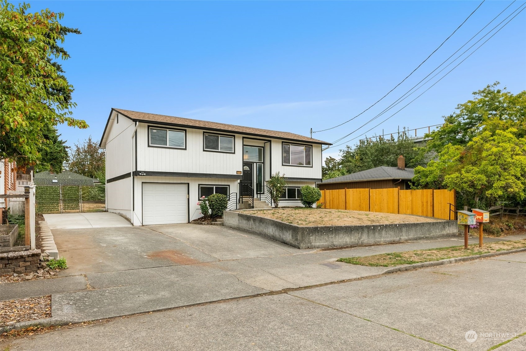 3932 South Morgan Street Seattle, WA 98118 - Photo 2 of 40 a view of house with outdoor space and porch