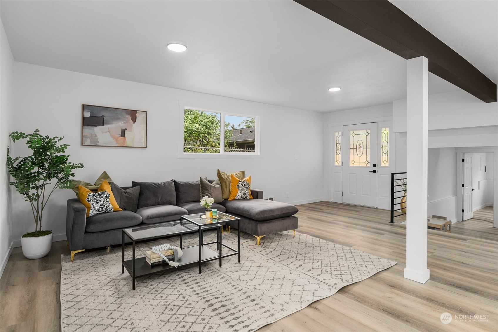 3932 South Morgan Street Seattle, WA 98118 - Photo 21 of 40 a living room with furniture and wooden floor