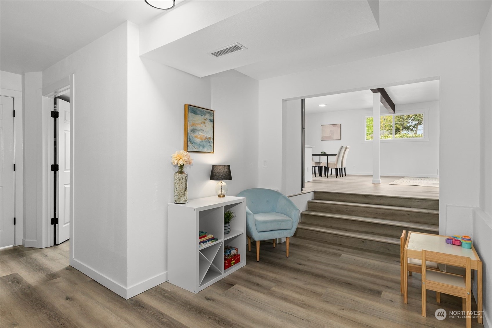3932 South Morgan Street Seattle, WA 98118 - Photo 25 of 40 a view of hall way with furniture and wooden floor