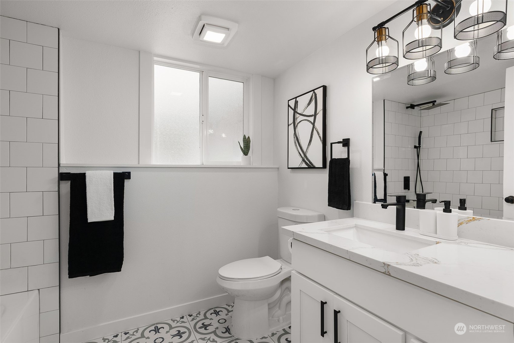 3932 South Morgan Street Seattle, WA 98118 - Photo 28 of 40 a bathroom with a sink a toilet and mirror