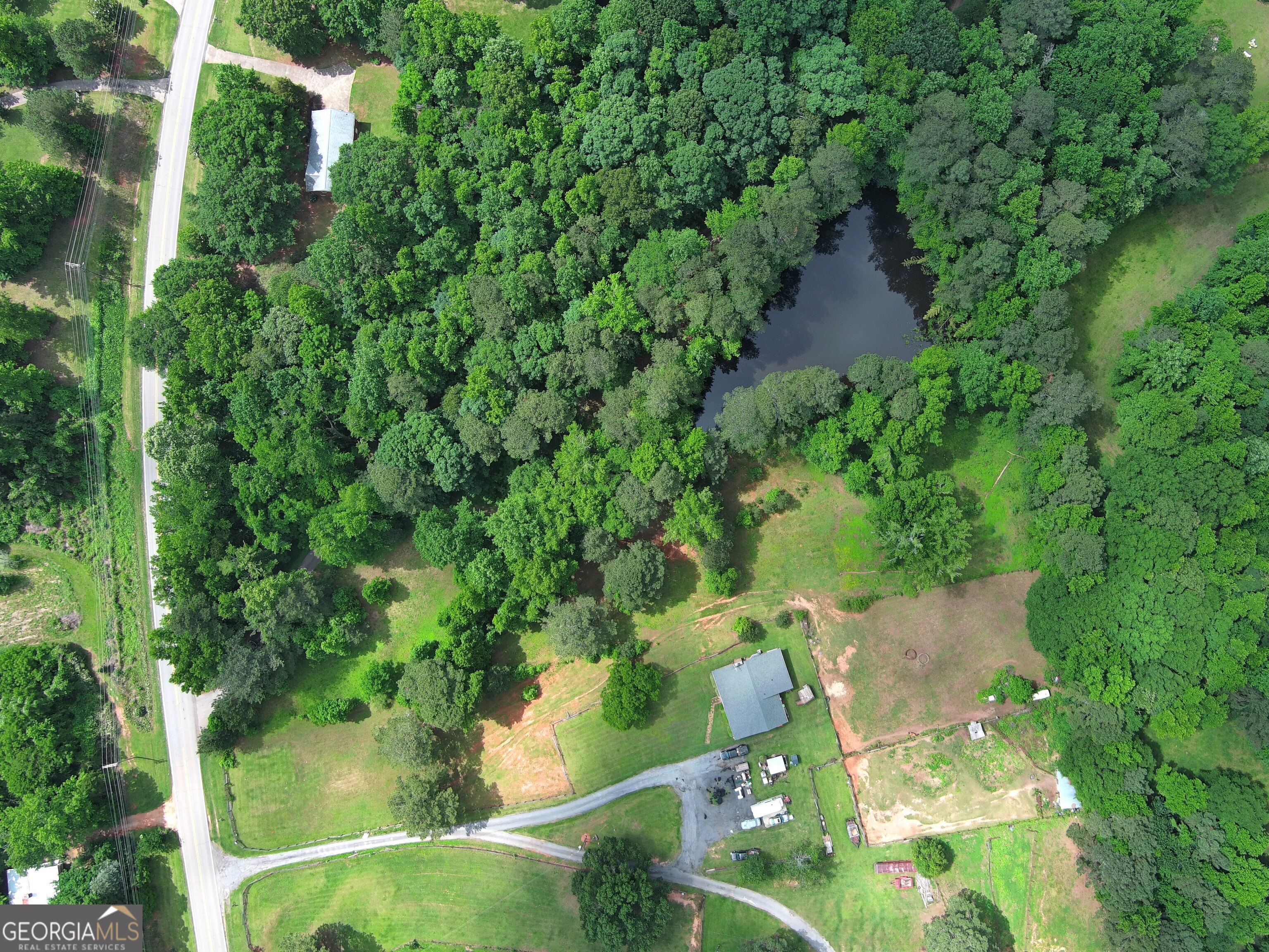491 Thurman Road, Unit TRACT C Stockbridge, GA 30281 - Photo 4 of 18 an aerial view of residential house with outdoor space and trees all around