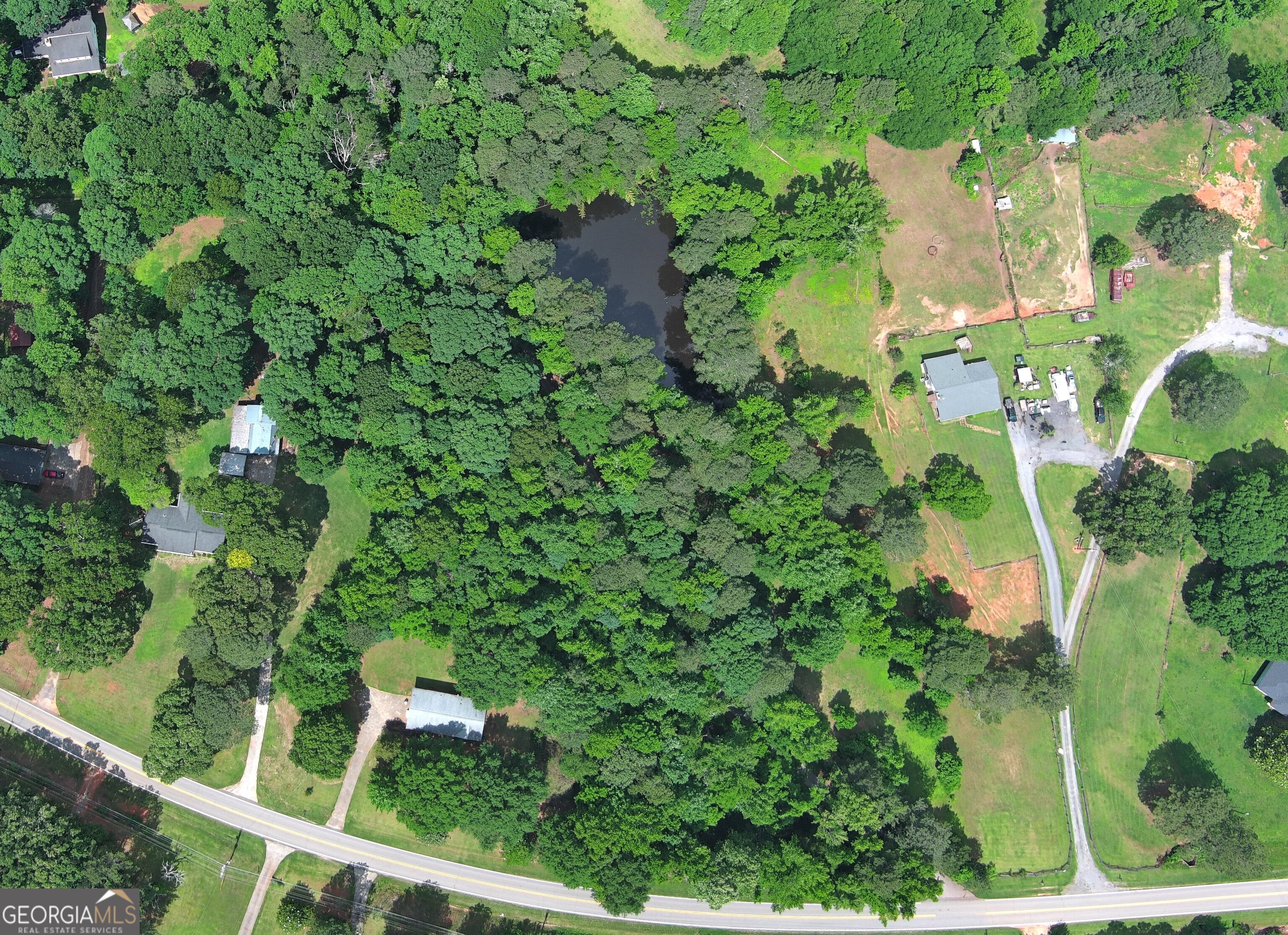 491 Thurman Road, Unit TRACT C Stockbridge, GA 30281 - Photo 10 of 18 an aerial view of a house with a yard