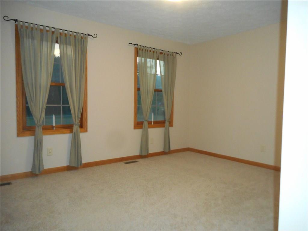 130 Vance Road New Castle, PA 16102 - Photo 12 of 25 14x12 bedroom features a walk-in closet and front view of acreage.