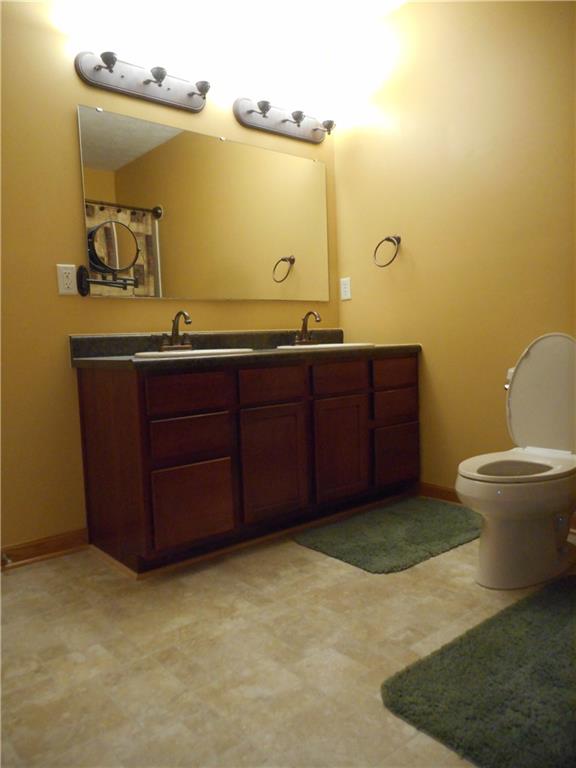 130 Vance Road New Castle, PA 16102 - Photo 15 of 25 First floor master bath with double sinks adjacent to the first floor master bedroom.
