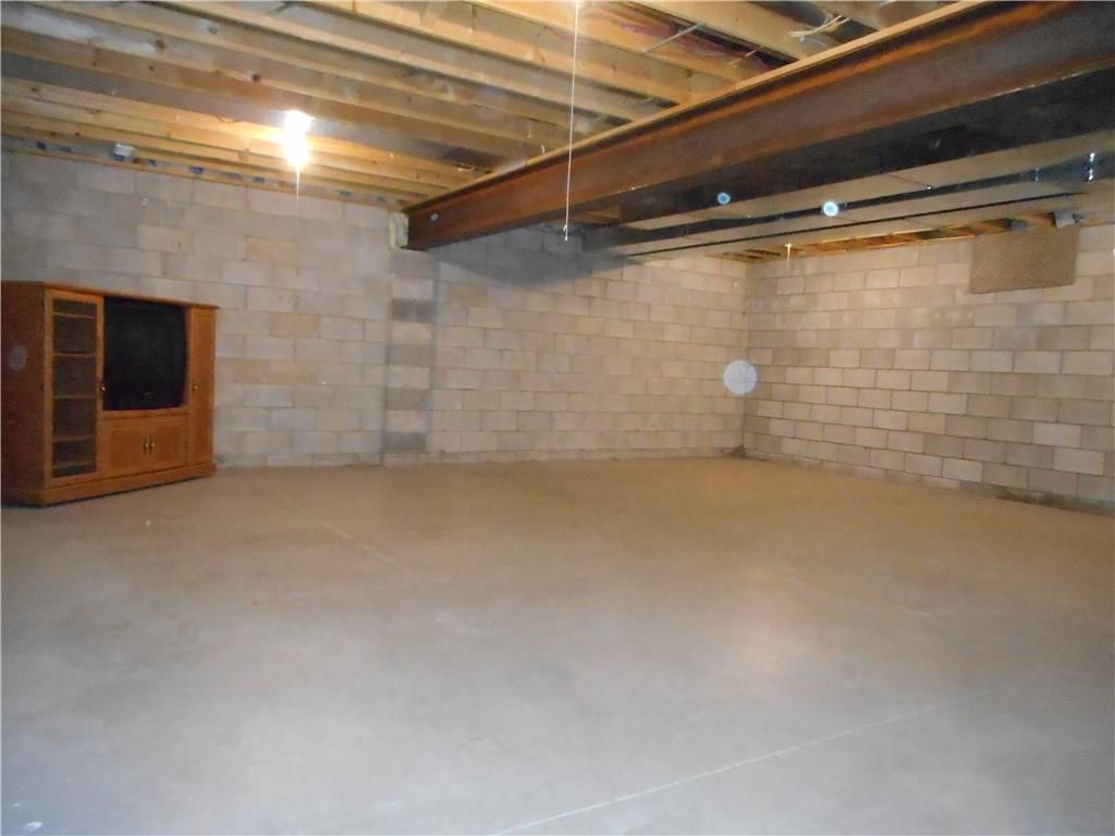 130 Vance Road New Castle, PA 16102 - Photo 16 of 25 Full unfinished basement, great high ceilings for a game/family room and steel beam for long term support.