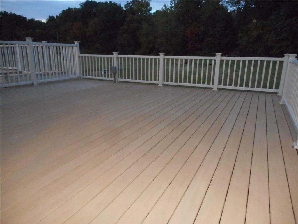 130 Vance Road New Castle, PA 16102 - Photo 20 of 25 38x20 Extra large deck with full railings opens to the ground 21 foot pool & 7 person hot tub all adjoining the wrap around deck.