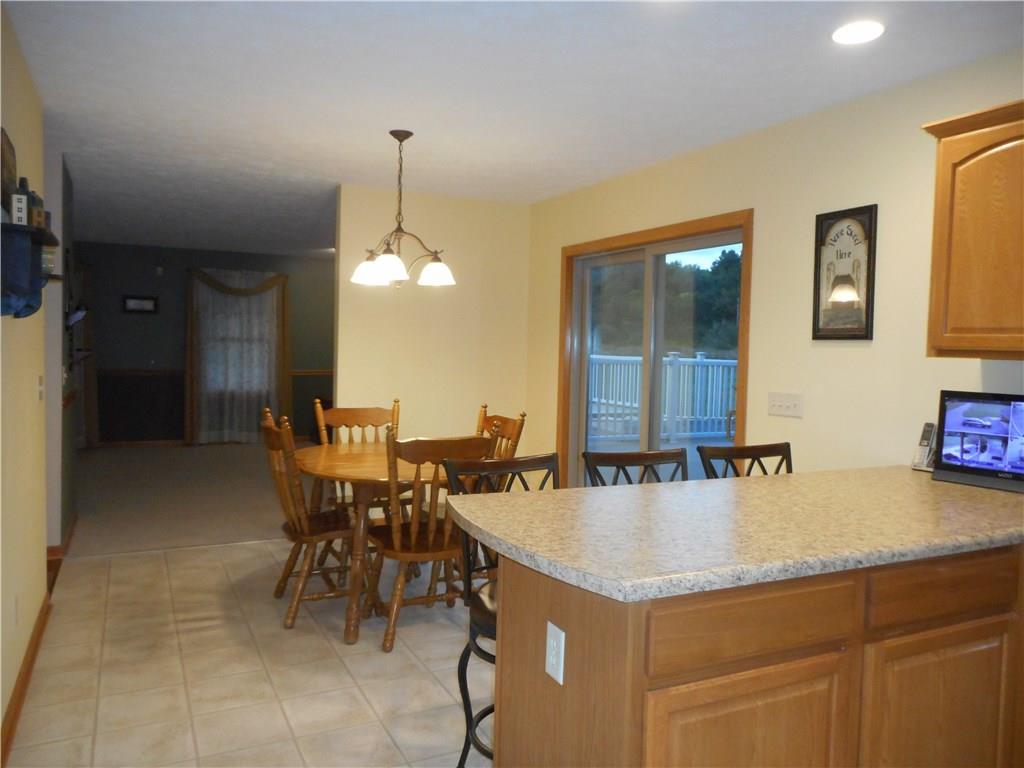 130 Vance Road New Castle, PA 16102 - Photo 7 of 25 large open eating area of kitchen with sliders to the extra large deck, pool & hot tub.