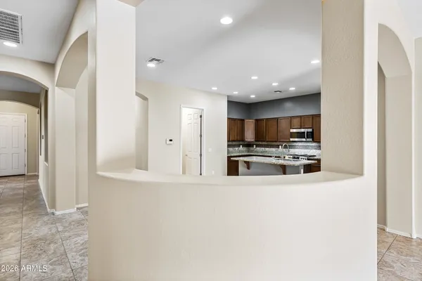 a kitchen with stainless steel appliances granite countertop a stove sink and cabinets