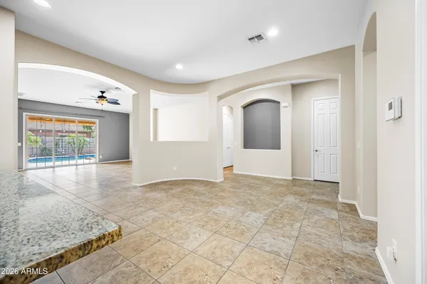 a view of an empty room with a large window