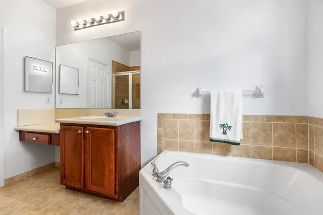 a bathroom with a sink and mirror